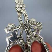 Antique silver scissors with rich putto and flowers relief decor Germany 1900