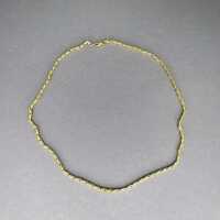 Unusual chain necklace in 14 k yellow and white gold...