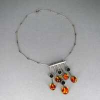 Abstract statement collier from silver and amber...