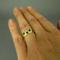 Beautiful 14 k gold band ring with 4 deep green tourmaline