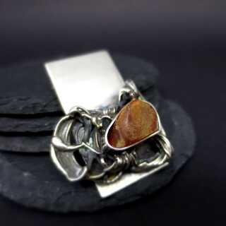 Abstract designer artistic silver brooch with natural Baltic amber cabochon