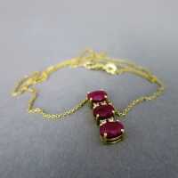 Modern pendant in 14 k gold with rubies and diamonds incl. chain