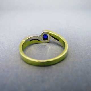 Ladys two tone 18 k white and yellow gold ring with sapphire and diamonds