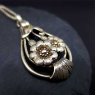 Late Art Deco pendant in open worked design silver with floral decor and chain