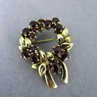 Beautiful wreath brooch in gold with deep red bohemian...