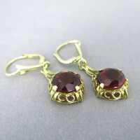 Dangling earrings in gold with red tourmaline Wilhelm...