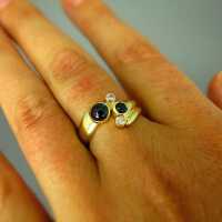 Beautiful ladys ring in gold with blue sapphires and sparkly diamonds