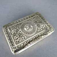 Antique small pill box in silver and gold with rich floral pattern and monogram