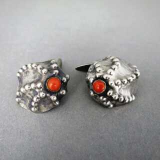 Unique shell-shaped handmade cufflinks in silver with red coral cabochons