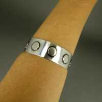 Modernist abstract bangle in solid silver with disc decoration Handmade