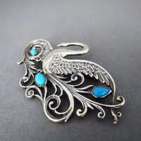 Elegant Art Nouveau style swan brooch in silver with blue turqoise cabochons