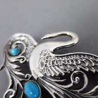 Elegant Art Nouveau style swan brooch in silver with blue turqoise cabochons