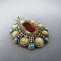 Beautiful silver and gold filigree pendant with turqoiuses and brown crystal cab
