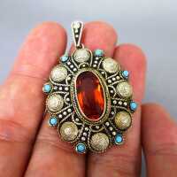 Beautiful silver and gold filigree pendant with turqoiuses and brown crystal cab