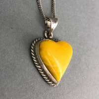 Elegant silver pendant set with a Butterscotch amber around 1960