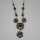 Magnificent necklace in floral design studded with deep red garnet