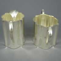 Art Deco silver set milk jug and sugar from England,...