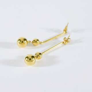 Elegant long golden stud earrings with polished balls