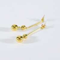 Elegant long golden stud earrings with polished balls