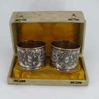 Antique pair of napkin rings in silver with griffins in...