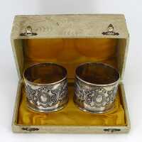 Antique pair of napkin rings in silver with griffins in...