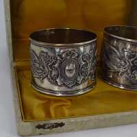 Antique pair of napkin rings in silver with griffins in original box