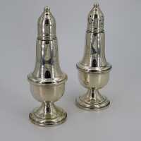 Antique salt and pepper shakers in sterling silver with glass insert