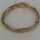 Fancy gold bracelet in four strands braided around 1960