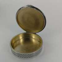 Charming round box in silver with rich decor