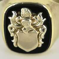 Mens signet ring with gold crest on onyx plate