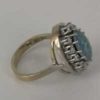 Beautiful ladies ring in 585 gold with fiery opal triplet and twelve diamonds