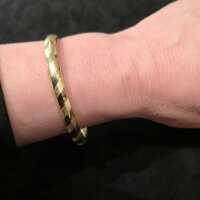 Beautiful oval two-piece bangle in gold