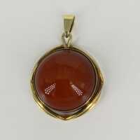 Modernist pendant in gold with a carnelian cabochon