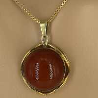 Modernist pendant in gold with a carnelian cabochon