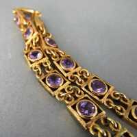Link bracelet with amethyst cabochons mounted in gold 