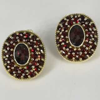 Gorgeous oval ear clips in silver gold-plated with countless red garnet stones