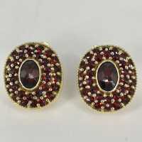 Gorgeous oval ear clips in silver gold-plated with countless red garnet stones