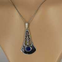 Silver pendant with lapis lazuli in a geometric shape...