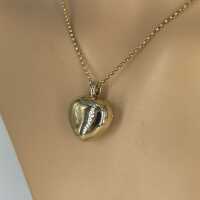 Solid heart pendant in 750 yellow and white gold