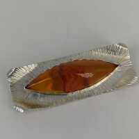 Amber brooch in silver in modernism around 1960