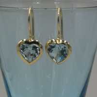Gold earrings with elaborate heart-cut topazes