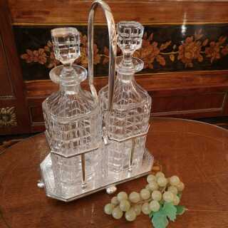 A pair of rare English whiskey bottles with holders from around 1880 Tantalus
