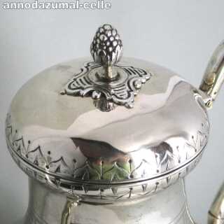Georgian silver coffeepot with engraved decor