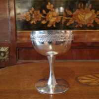 Wine cup with a hammered look and fine chasing around 1930