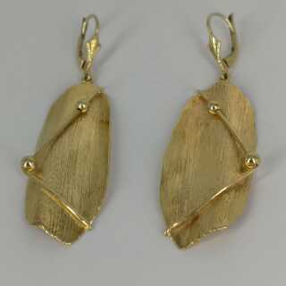 Modern earrings in gold in an abstract form