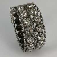Vintage silver bangle with floral decoration
