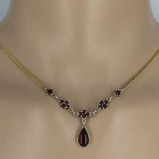 Beautiful delicate gold necklace with garnet stones
