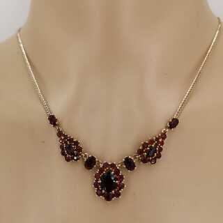 Beautiful gold necklace with red garnet stones including a gold chain