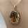 Large pendant in gold with a large straw yellow noble topaz