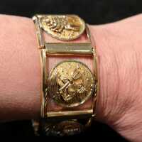Armband mit verschiedenen astrologischen Zeichen in Gold und Platin 